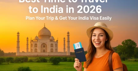 Happy traveler holding passport with India landmark background, get india visa to india